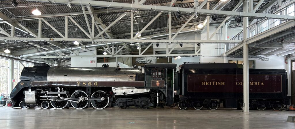 Image of Canadian Pacific Railway Royal Hudson #2860 and tender inside the roundhouse at the Railway Museum of BC.