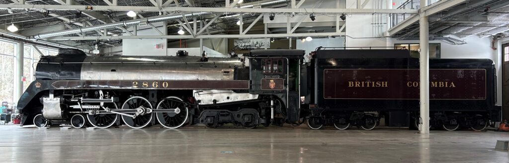 Image of Canadian Pacific Railway Royal Hudson #2860 and tender inside the roundhouse at the Railway Museum of BC.