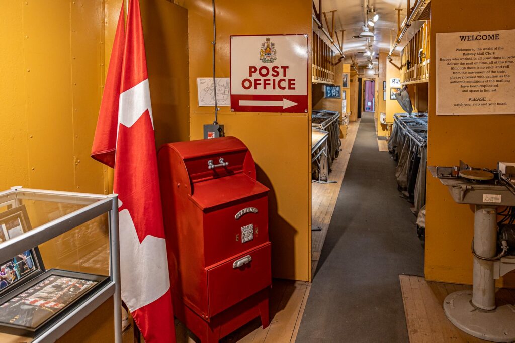 Image of inside Post Office car showingmailbox, flag and sorting station